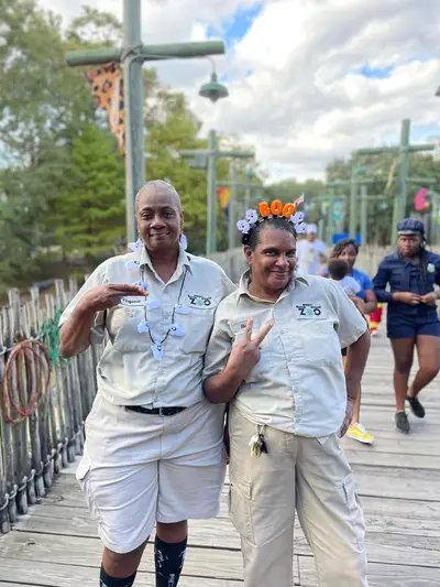 Two groundskeepers posing together at the Baton Rouge Zoo
